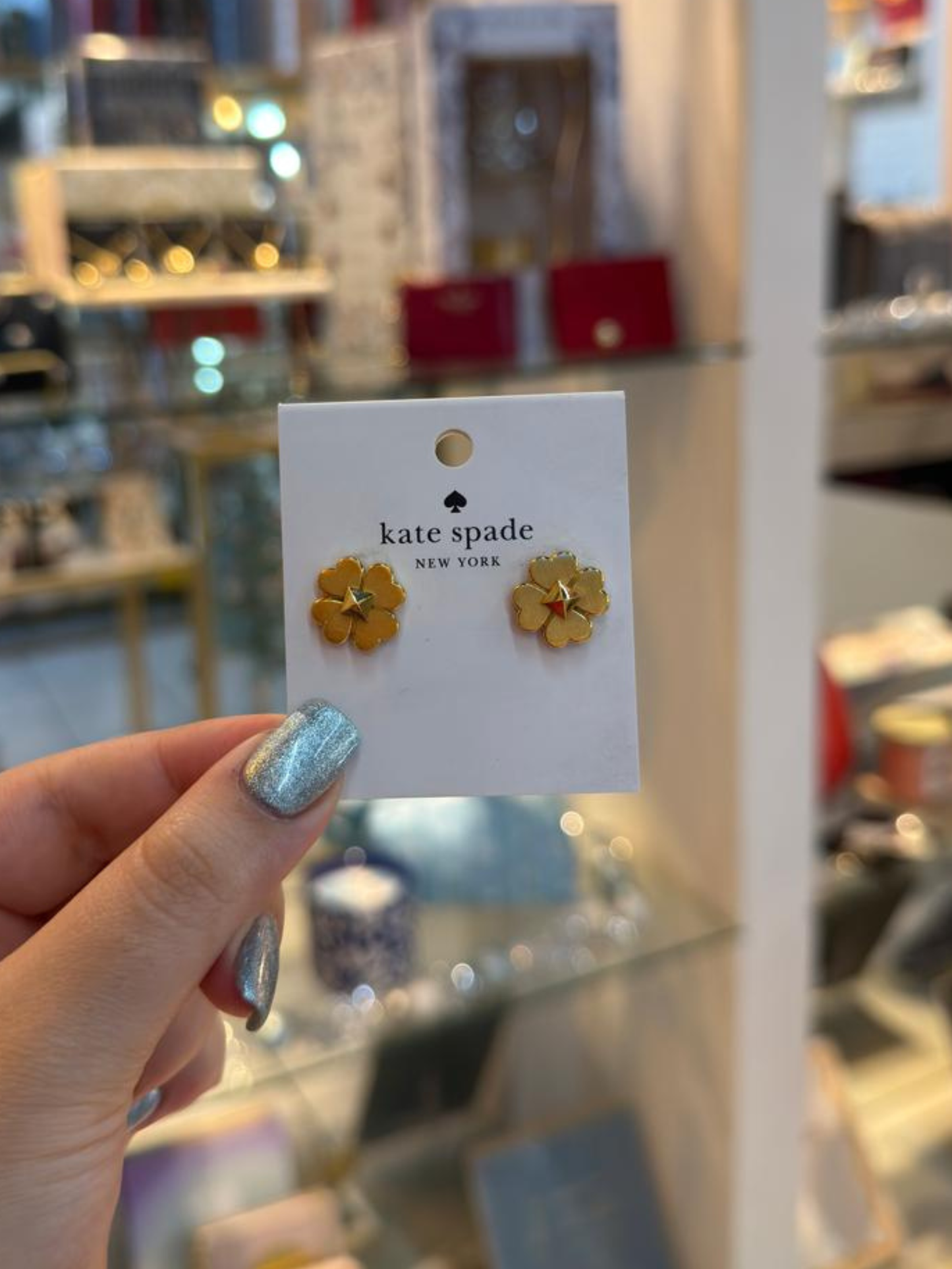 Aretes trebol dorados Kate Spade
