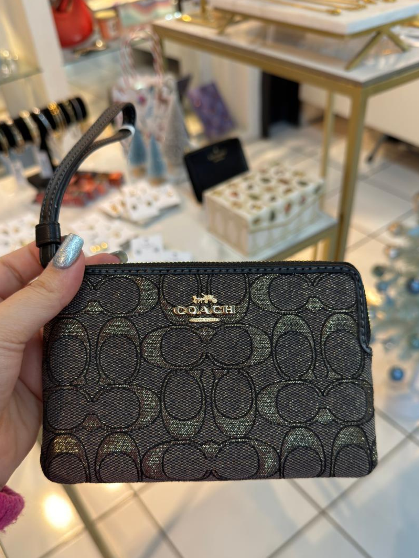 Wrislet azul con dorado Coach